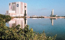 Kennedy Space Center rises above the water